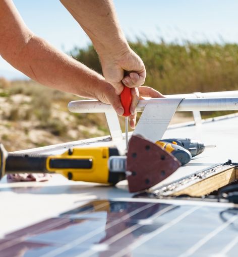 Mechanic Installing Solar Panels